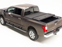 Solid Fold 2.0 Tonneau Cover Black Textured Paint 2005-2021 Nissan Frontier 6' Bed with Factory Bed Rail Caps Extang
